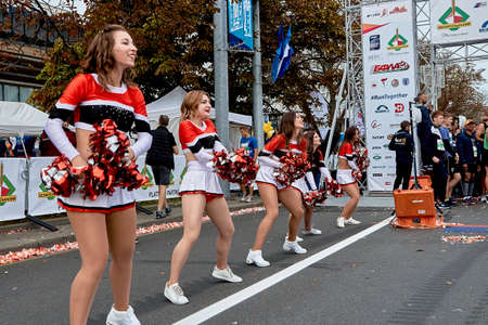 September 15, 2019 Minsk Belarus There are dancing girls cheerleaders before the start of the marathonのeditorial素材
