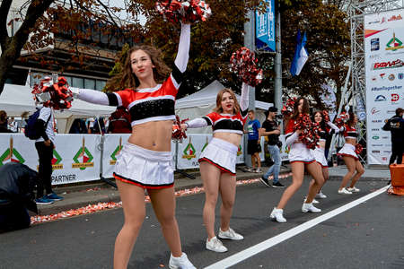 September 15, 2019 Minsk Belarus There are beautiful dancing girls cheerleaders before the start of the marathonのeditorial素材