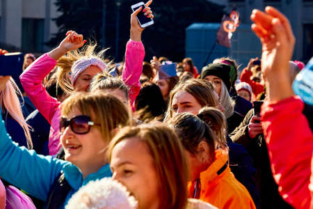 March 8, 2019 Minsk Belarus Women's Day Race on March 8 There is a close up of young women with their hands up at a street concertのeditorial素材