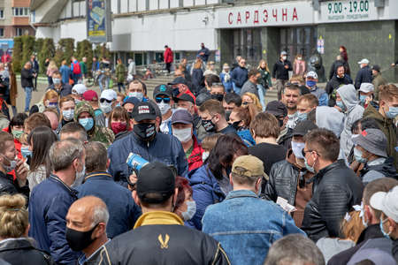 May 24 2020 Minsk Belarus An opposition leader with a loudspeaker who communicates with masked people during a protest and a pandemicのeditorial素材