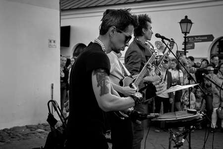 June 1, 2019 Minsk Belarus In the black and white image, three musicians are playing at a street concertのeditorial素材