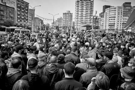 May 24 2020 Minsk Belarus Black and white image. Demonstration against the current government, led by an opposition leader who communicates with masked people during a protestのeditorial素材