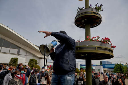 May 24 2020 Minsk Belarus Opposition leader Tikhonovsky makes a loud statement to the people using a loudspeaker in the squareのeditorial素材