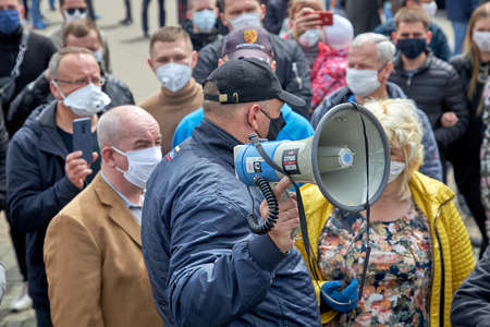 May 24 2020 Minsk Belarus The speaker in the hand of one of the opposition who stands among the peopleのeditorial素材