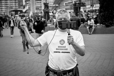 June 7 2020 Minsk Belarus In a black and white image opposition blogger Nikolaj Maslovskij is broadcasting live on the streetのeditorial素材