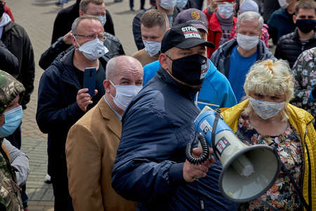 May 24 2020 Minsk Belarus Opposition leader Tikhonovsky with a loudspeaker in his hand stands among the peopleのeditorial素材