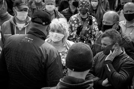 May 24 2020 Minsk Belarus In the black-and-white image, opposition leader Tikhonovsky talks to a womanのeditorial素材
