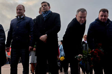 Crowd people offering laying the flowers on the monument to Lenin on anniversary of the communist revolution. November 7, 2019 Minsk Belarusのeditorial素材