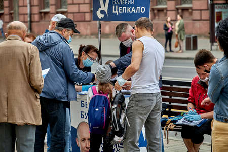 June 7 2020 Minsk Belarus People stand in line to cast their votes for the candidate for the post of president of the republic of Belarus.のeditorial素材