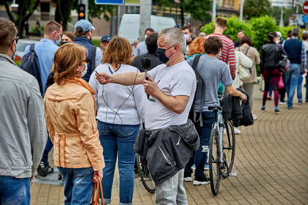 June 7 2020 Minsk Belarus Opposition blogger Nikolai Maslovsky is broadcasting live on the street asking people questions during the pandemicのeditorial素材
