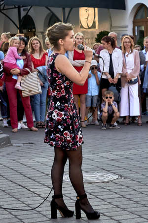 May 25, 2019 Minsk Belarus A street concert in which a beautiful woman with a microphone singsのeditorial素材