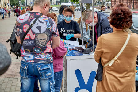 June 7 2020 Minsk Belarus A man and a woman of the initiative group register signatures for an opposition candidate for the post of President of the Republic of Belarusのeditorial素材