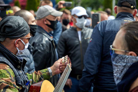 May 24 2020 Minsk Belarus A street musician plays the guitar among the peopleのeditorial素材