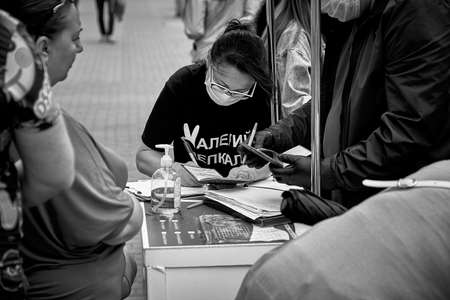 June 7 2020 Minsk Belarus In black and white, there is a picket where a woman collects signatures for an opposition presidential candidateのeditorial素材