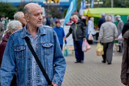 June 14 2020 Minsk Belarus A Mature man walks along a city streetのeditorial素材