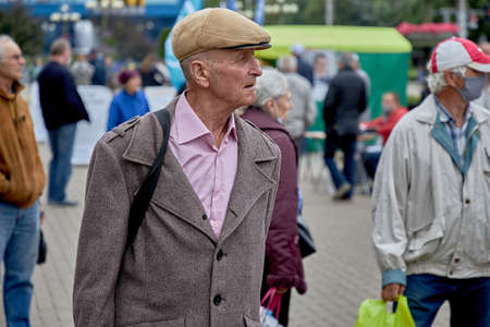 June 14 2020 Minsk Belarus A senior man walks along a city streetのeditorial素材