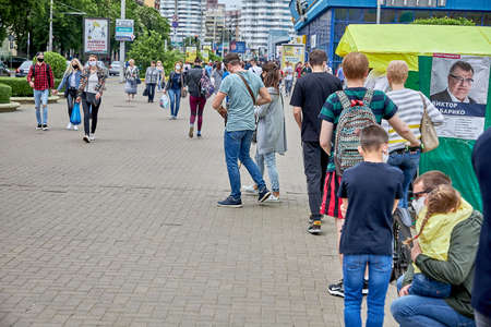 June 7 2020 Minsk Belarus Masked people stand in line at a picket line to collect signatures for an alternative presidential candidateのeditorial素材