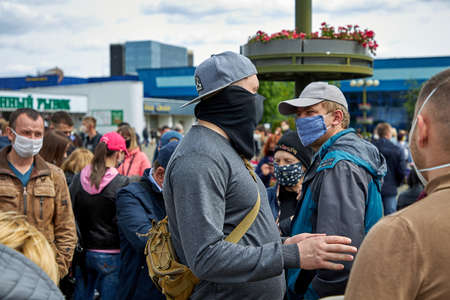 May 24 2020 Minsk Belarus A lot of masked people walk around the square in protestのeditorial素材