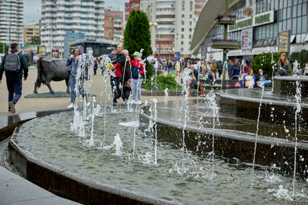 June 14 2020 Minsk Belarus Fountain on the background of walking peopleのeditorial素材