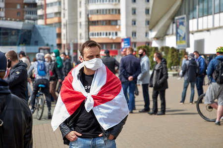 May 24 2020 Minsk Belarus There is a man with opposition flag in the squareのeditorial素材