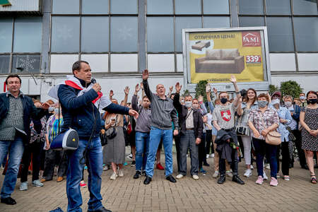 June 7 2020 Minsk Belarus The rally when the opposition leader wrapped in a flag with a microphone asked people a question and many people raised their hands in the airのeditorial素材