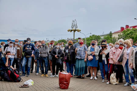June 7 2020 Minsk Belarus Rally, when masked people stand near packages to collect moneyのeditorial素材