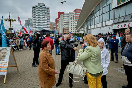 June 14 2020 Minsk Belarus An opposition blogger who broadcasts live interviews Mature women arguing on political topicsのeditorial素材