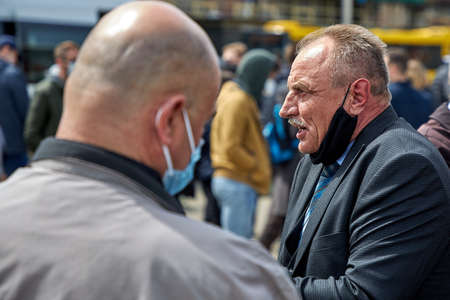 May 24 2020 Minsk Belarus A close-up of an elderly man tells people about a protest demonstrationのeditorial素材