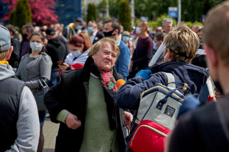 May 24 2020 Minsk Belarus. An elderly woman tells a reporter about her hard lifeのeditorial素材