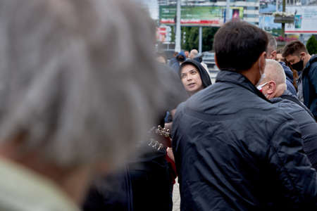 June 14 2020 Minsk Belarus A young woman plays a guitar among people during a protest against the current governmentのeditorial素材