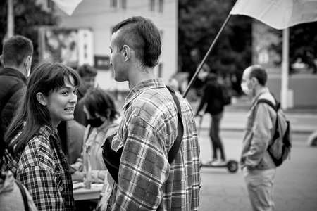 June 14 2020 Minsk Belarus A couple stands among a crowd of people and talks in the streetのeditorial素材