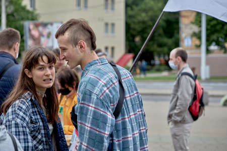 June 14 2020 Minsk Belarus A couple stands among a crowd of people and talks at the collection of signatures for the presidential candidateのeditorial素材