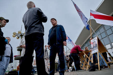 June 14 2020 Minsk Belarus A man talks to a presidential candidate on the streetのeditorial素材