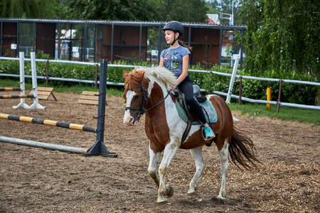 June 21 2020 Minsk Belarus A young teenage girl rides a harseのeditorial素材