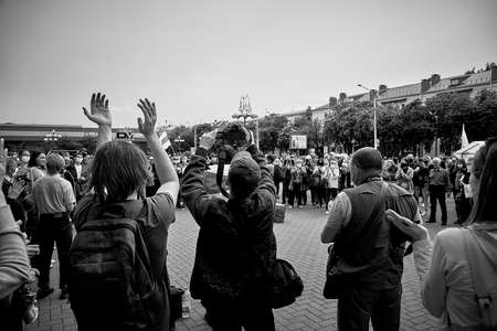 June 7 2020 Minsk Belarus A rally where people stand with their hands up and protest in the squareのeditorial素材
