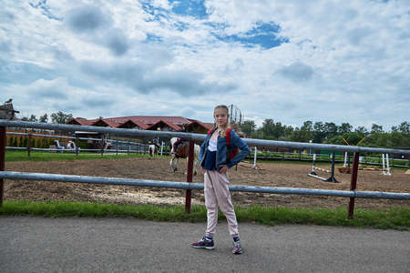 June 21 2020 Minsk Belarus Beautiful teen stands on the road to the Park in the cityのeditorial素材