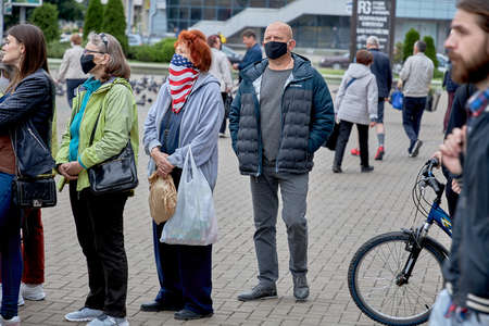 June 14 2020 Minsk Belarus An elderly woman in a mask of the color of the United States stands in...