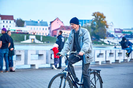 October 19, 2019 Minsk Belarus People walking along the embankmentのeditorial素材