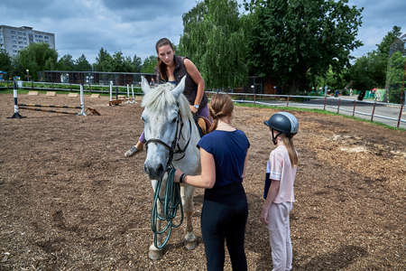 June 21 2020 Minsk Belarus A young teenage girl rides a horseのeditorial素材