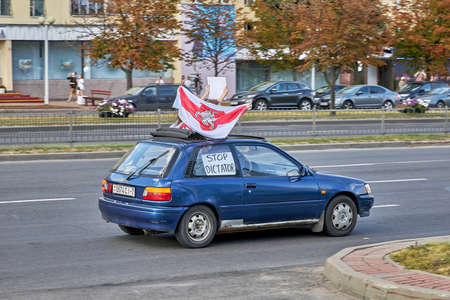 August 15 2020 Minsk Belarus A car with an opposition flag and a stop dictator posterのeditorial素材