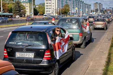 August 15 2020 Minsk Belarus A car with an opposition flag and a stop dictator posterのeditorial素材