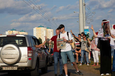 August 15 2020 Minsk Belarus Many people stand by the roadside to protest against violenceのeditorial素材