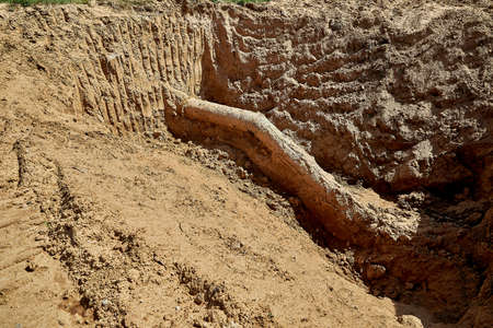 One old water pipe was discovered during the reconstruction of the water supply system in the groundの写真素材