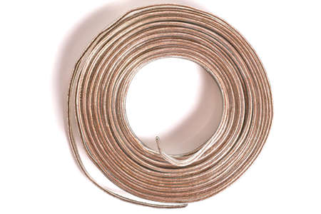 Top view of coiled audio cable isolated on whiteの写真素材