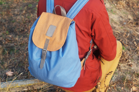 backpack hanging on the back girl's shouldersの写真素材
