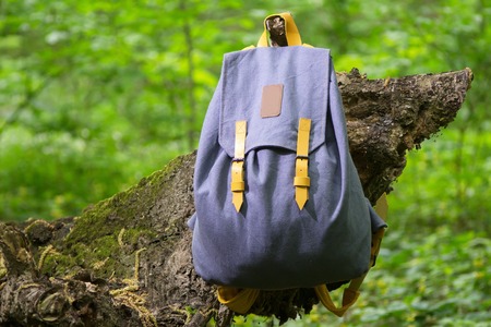 handmade backpack on the tree photographed close-upの写真素材