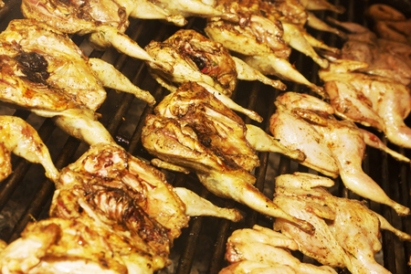 Appetizing, chicken, quail meat roasted on skewers BBQ grill. Grilled meat. Grilled meat on food festival. Food fair suggest delicious meat cooked on bbq.の写真素材