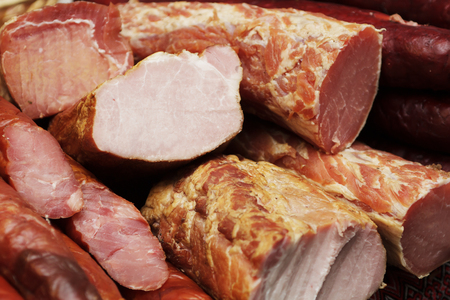 Beef ham. ham meat beef on chopping board background. Sausage, rustic country style. Delicious meat...