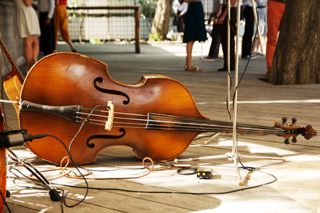 Double bass contrabass on rustic wooden floor. Beautiful string music instrument.の写真素材