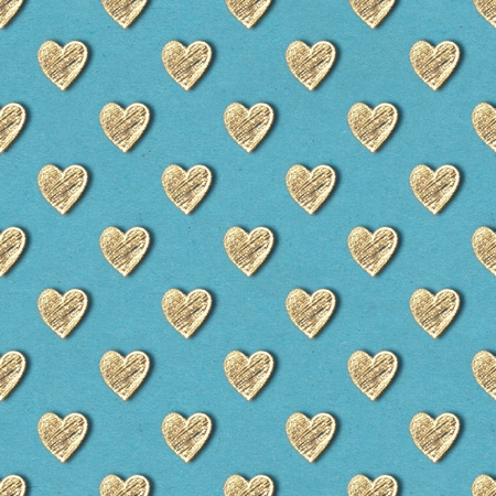 Golden hearts seamless pattern. Gold glitter on blue old paper backgroundの写真素材